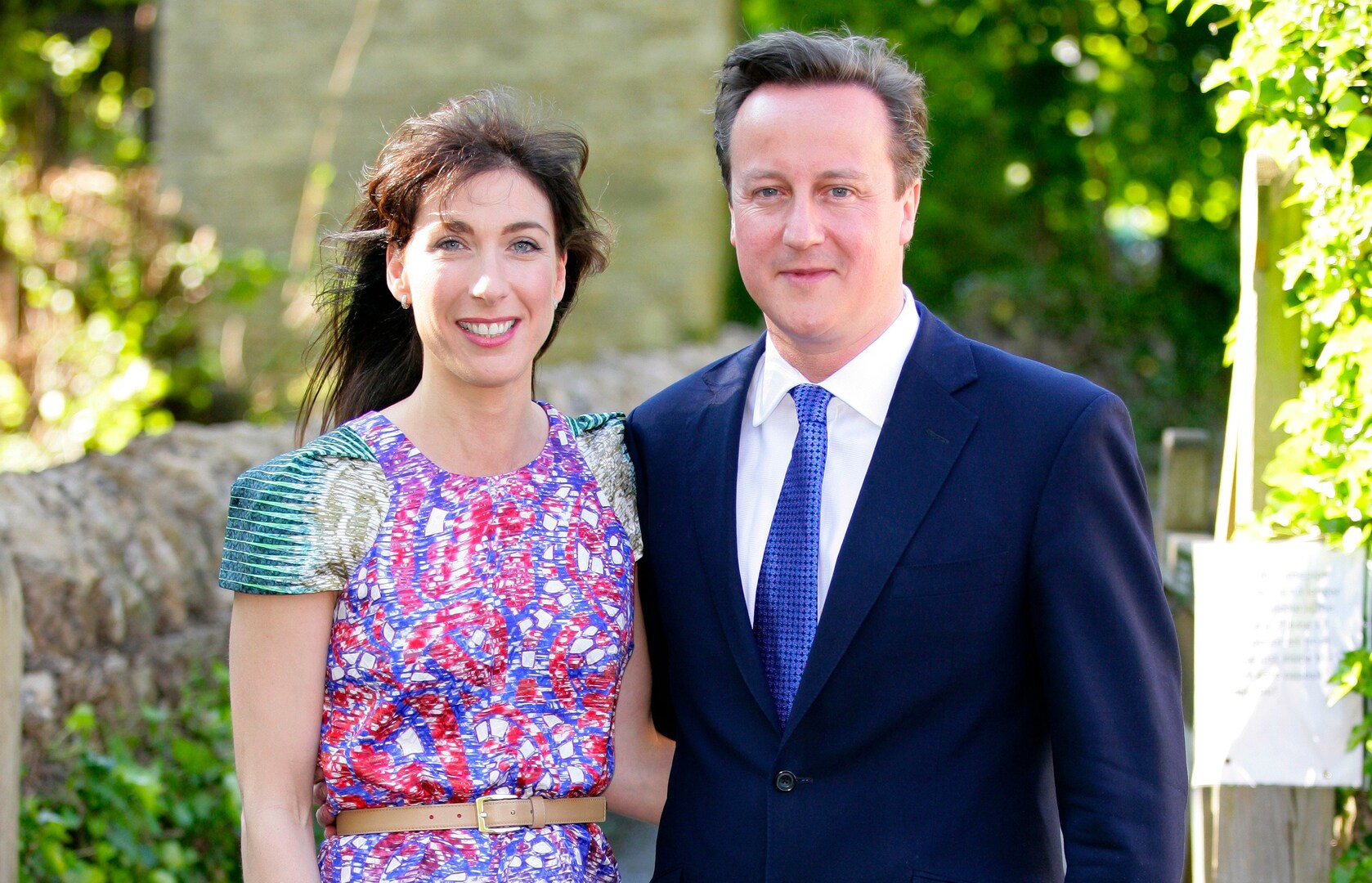 Samantha and David Cameron at a wedding.