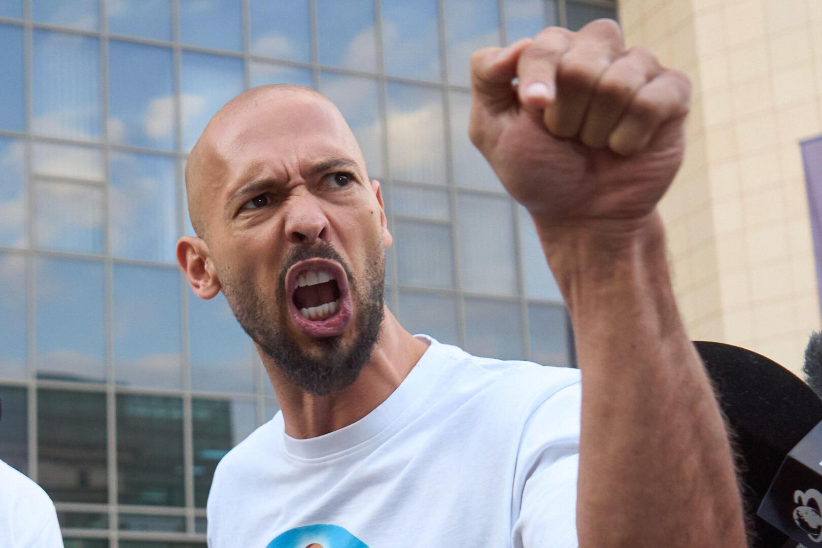Bucharest, Romania. 22dn Aug, 2024: Andrew Tate (R) and his brother Tristan Tate (L) leave the Bucharest Court, Andrew under house arrest and Tristan under judiciary control, after being held in custody for 24 hours. DIICOT officers executed a home s
